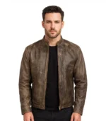 Front view of a men’s distressed brown leather biker jacket with a vintage weathered finish, quilted shoulders, and silver zippered pockets.
