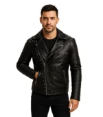 A men's black leather motorcycle jacket featuring silver pyramid studs on the lapels and shoulders, with an asymmetrical zip and belt.