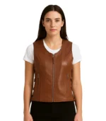 A men’s brown leather biker vest featuring a classic asymmetrical zipper, wide notched lapels with silver snaps, and a rugged sleeveless design.