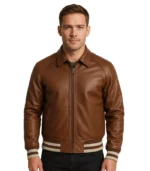 Men’s Walton varsity jacket featuring a chocolate brown leather body, contrasting white leather sleeves, and striped ribbed-knit trim.