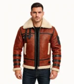 A product video of a men’s rust-colored leather bomber jacket featuring a plush cream shearling collar, ribbed cuffs, and a heavy-duty zip closure.