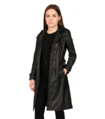 A long-length black leather trench coat for men featuring a practical drawstring hood, button-front closure, and a sleek, weather-resistant finish.