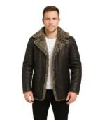 A men’s Furlong black leather long-length coat featuring a heavy-duty quilted body, a large fur-lined hood, and a rugged zip-front closure.