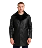 A men’s 3/4 length black leather coat featuring a plush black shearling lining, an oversized shearling collar, and a rugged yet polished finish.