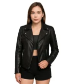 A sophisticated woman wearing a sleek asymmetrical leather biker jacket with a professional lapel collar and structured fit.