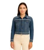 A women’s Kasey denim trucker jacket featuring colorful floral embroidery across the back and shoulders on a medium-wash blue denim.