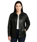 A product video of a women’s oversized black leather trucker jacket featuring a classic button-down front, chest flap pockets, and a relaxed drop-shoulder fit.