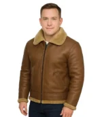 A classic men’s B3 aviator jacket in dark brown sheepskin leather, featuring a thick cream shearling lining, buckled collar, and adjustable waist straps.