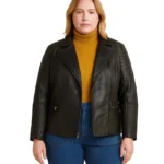 Front view of a woman wearing a black plus-size leather jacket with horizontal quilted stitching on the shoulders and sleeves.