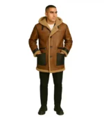 A men’s Logan shearling coat featuring a rugged brown leather exterior, a thick cream-colored wool collar, and a warm sheepskin lining.