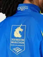 Fit view of the 2026 Boston Marathon blue jacket showing a comfortable cut for layering over tees or hoodies.