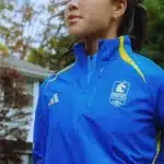 Boston Marathon Jacket 2026 in celebration blue with zip front, collar, and side pockets.