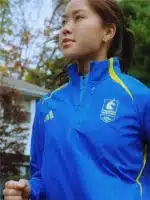 Boston Marathon Jacket 2026 in celebration blue with zip front, collar, and side pockets.