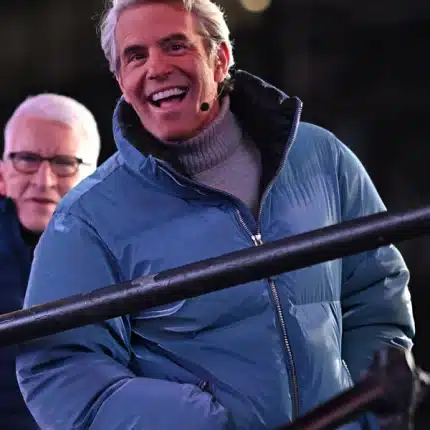 Andy Cohen Jacket New Year's featuring a metallic blue finish and warm puffer insulation.