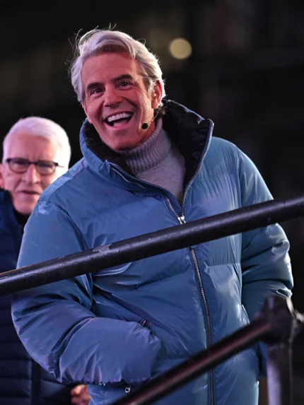 Andy Cohen Jacket New Year's featuring a metallic blue finish and warm puffer insulation.
