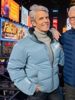 Andy Cohen New Year's Eve 2026 blue puffer jacket with water-resistant glossy fabric.