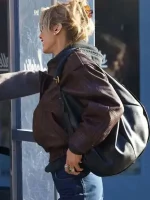 Side view of Bella Hadid brown leather jacket with tailored fit