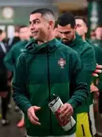 Angled view of Portugal green hooded qualifier jacket showing clean panels, zip front, and athletic fit for everyday wear.