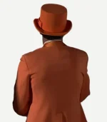 Back view of the orange tuxedo jacket by Zellberry Jackets, showing the smooth seams and cut.