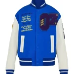 Front view of blue and white Wizard of Oz varsity jacket with wool body, leather sleeves, and snap button closure.