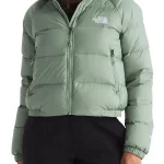 Front view of women’s olive green puffer jacket showing hooded style, zip closure, and warm padded panels.