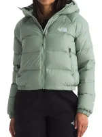 Front view of women’s olive green puffer jacket showing hooded style, zip closure, and warm padded panels.