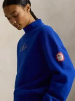 Women’s Team USA 2026 blue fleece mockneck sweatshirt showing ribbed cuffs and neat fit