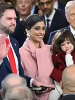 Full look of women’s pastel pink long coat with belt, sleek silhouette, and classy winter styling for events and outings.