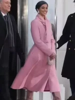 Side view of pastel pink belted coat showing long coverage, fitted waist, and clean sleeve shape for winter wear.