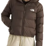 Front view of women’s hooded puffer jacket showing zip closure, padded panels, and warm winter street style fit.
