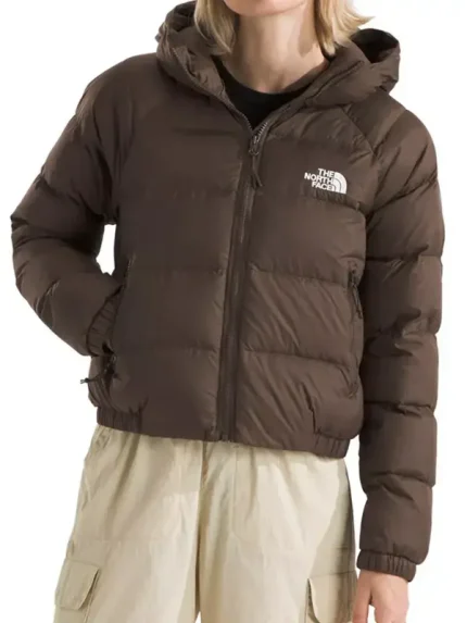 Front view of women’s hooded puffer jacket showing zip closure, padded panels, and warm winter street style fit.