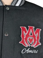 Amiri logo patch varsity jacket close up view of material and stitching