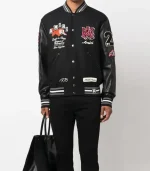 Amiri logo patch varsity jacket front view in clean streetwear style